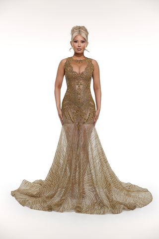 Woman wearing a gold evening gown on a white background